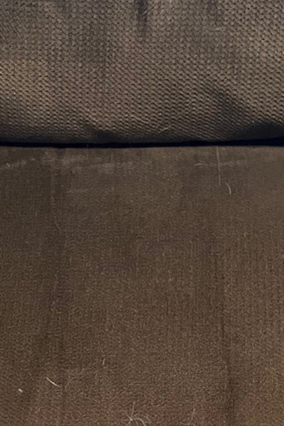 A brown couch cushion that's completely clean, no hair in sight.